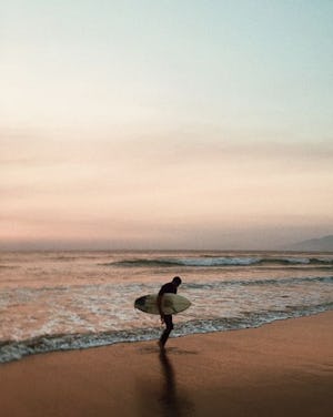 Man holding surfboard